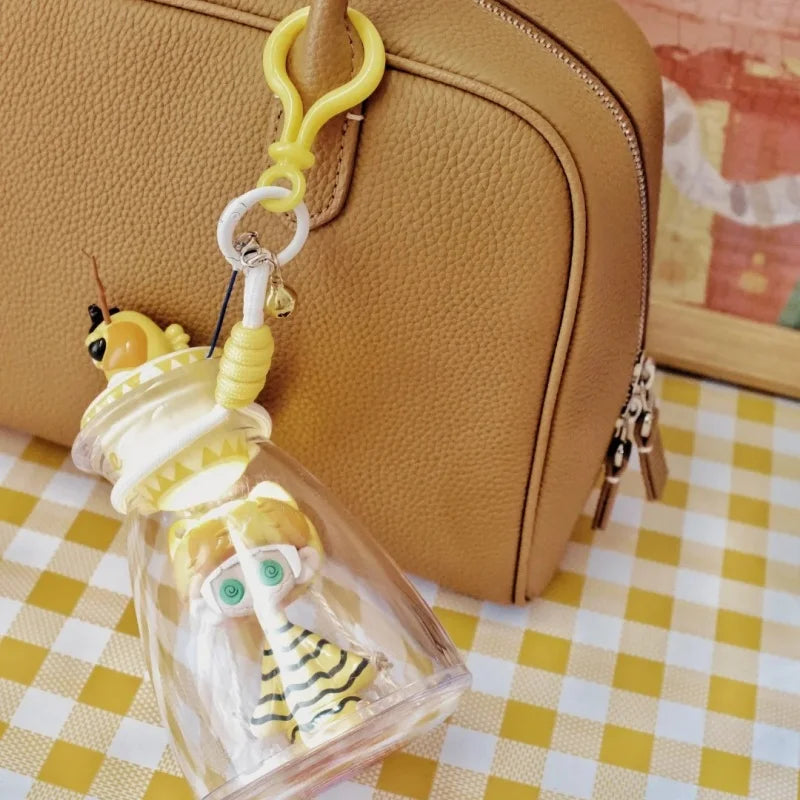 A yellow bee-themed bottle music blind keychain with a clear glass bottle containing a cute horror figure model gift