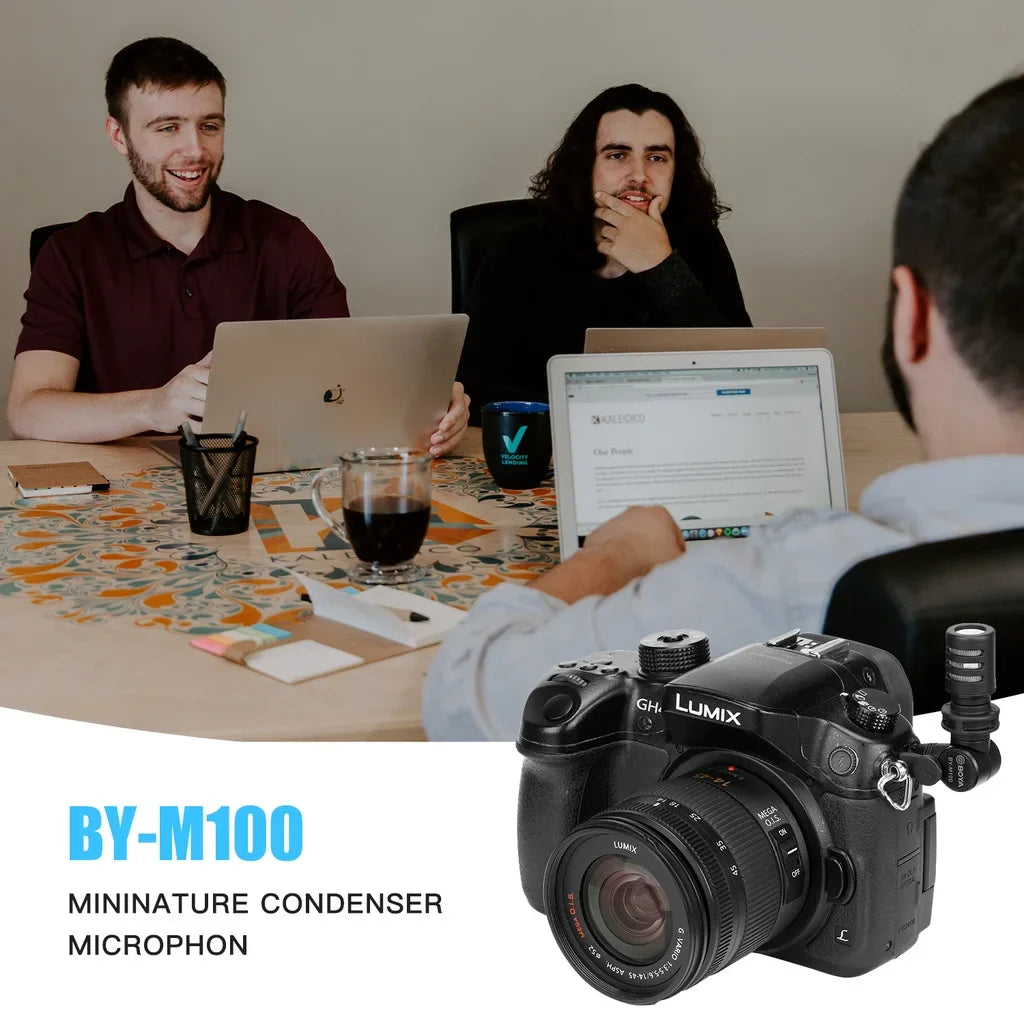Black lumix gh1 camera with mounted black boya by-m100 wired condenser microphone featuring a-weighted curve frequency response