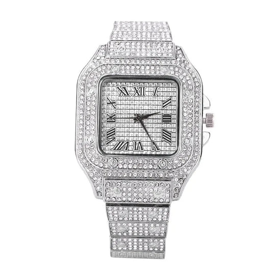 A stylish silver hip hop diamond watch with a square face, clear crystals, roman numerals, and alloy strap gold date quartz