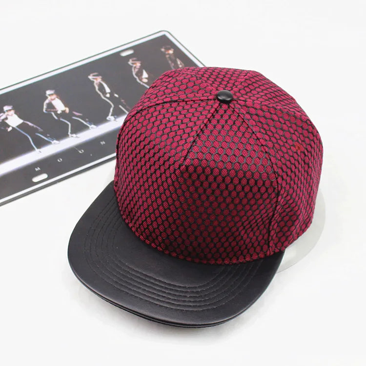 A maroon royal king crown baseball snapback cap with a black leather brim and textured mesh fabric crown