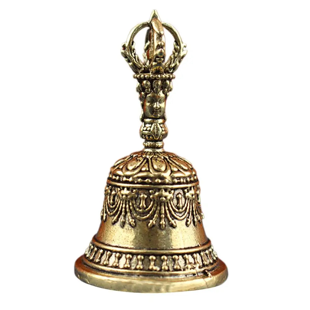 Golden ornate brass tibetan bell with intricate carvings and decorative handle in pestle set buddhist sound healing instruments