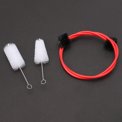 Brasswind musical instrument cleaning brush set with red flexible brush, black bristles, and white cylindrical tuba horn brushes