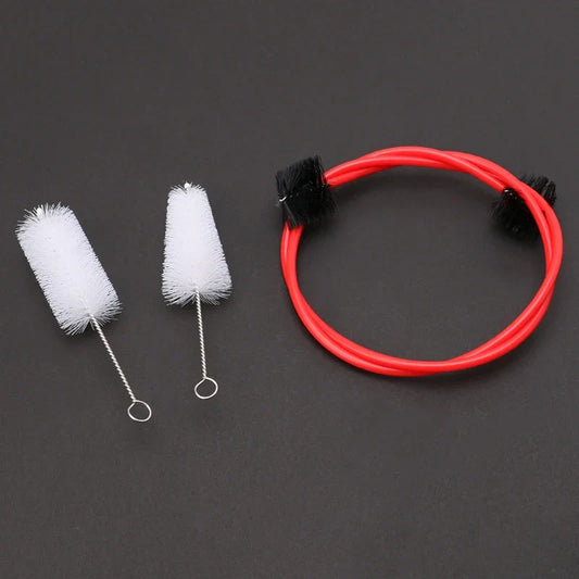 Brasswind musical instrument cleaning brush set with red flexible brush, black bristles, and white cylindrical tuba horn brushes