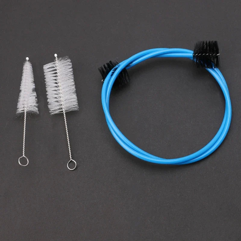 Blue flexible tube with black bristle attachments and two white brush tools for brasswind musical instrument tuba horn cleaning