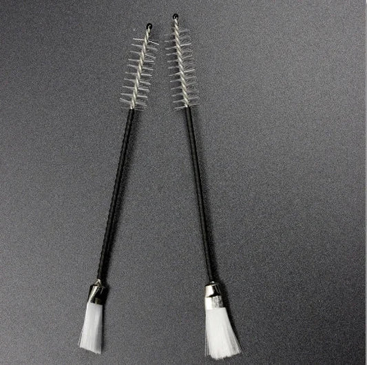 A pair of black-handled musical instrument cleaning brushes with clear bristles for alto sax clarinet flute piccolo