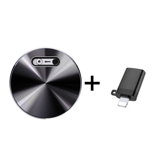 Black circular wireless charging pad with brushed metal finish and silver usb-c port paired with digital audio recording device sound dictaphone