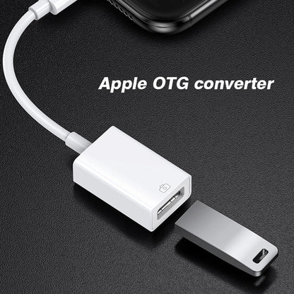 White byscoon otg adapter cable converter with lightning and usb-a port alongside a silver flash drive for iphone use