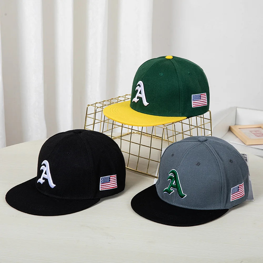 Hip-hop style baseball cap with a flat top, color patching, letter embroidery. Suitable for both women and men