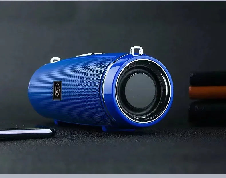 Blue cylindrical portable wireless speaker with textured surface and silver accents for high power outdoor stereo surround tws use