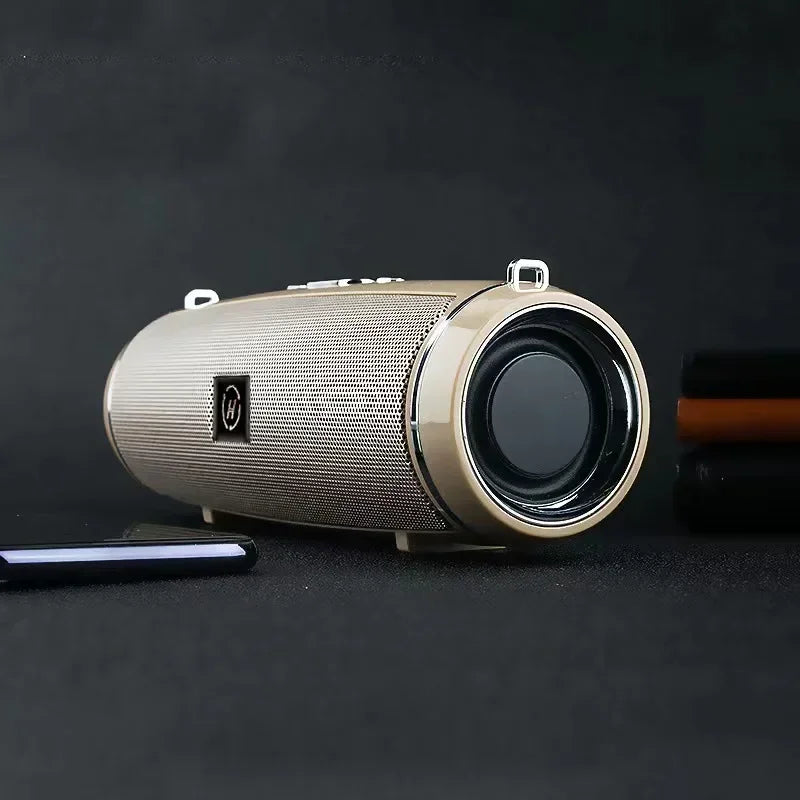 Gold-colored portable wireless speaker with textured mesh grille and black driver for high power outdoor stereo surround tws use
