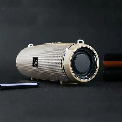 Gold-colored portable wireless speaker with textured mesh grille and black driver for high power outdoor stereo surround tws use