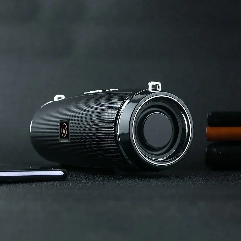 Black cylindrical som portable wireless speaker bluetooth 200w with textured fabric grille and silver trim for high power outdoor use
