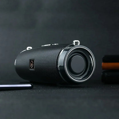 Black cylindrical som portable wireless speaker bluetooth 200w with textured fabric grille and silver trim for high power outdoor use