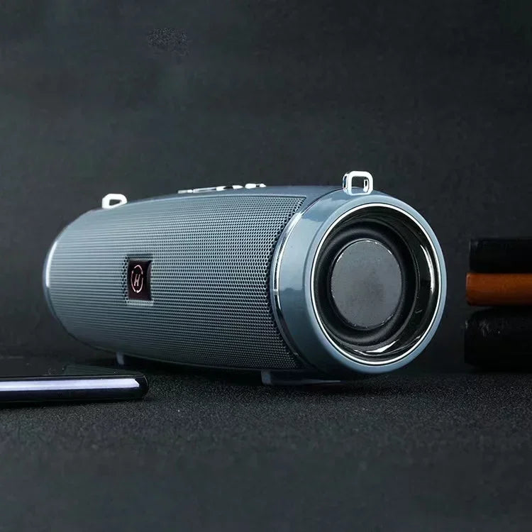 Gray cylindrical som portable wireless speaker bluetooth 200w with mesh grille and metallic silver accents for high power outdoor use