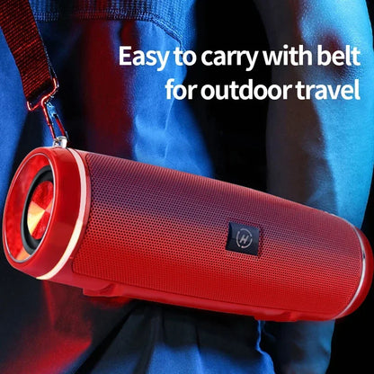 Red cylindrical portable wireless speaker with mesh grille and belt strap high power outdoor stereo surround tws audio
