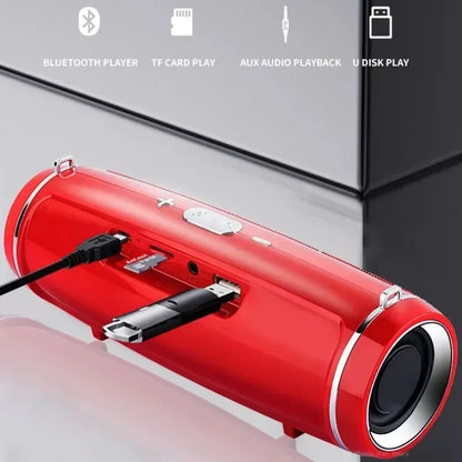 Red cylindrical som portable wireless speaker bluetooth 200w with silver trim and multiple input ports for high power outdoor use