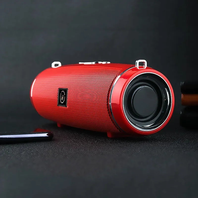 Vibrant red portable wireless speaker with textured mesh grille and chrome driver for high power outdoor stereo surround tws audio
