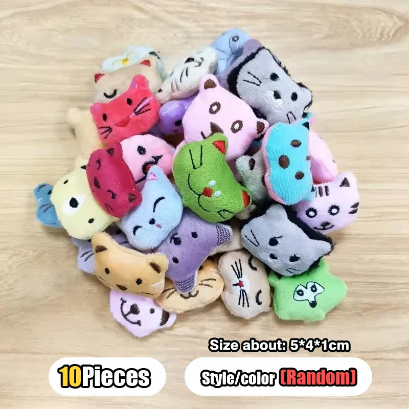 A pile of colorful plush cat-shaped toys featured in a candy claw machine with retro carnival music arcade claw machine