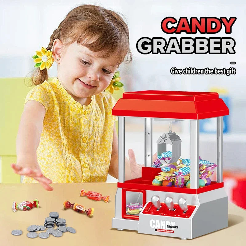 Red and silver candy claw machine with transparent front filled with colorful candies featuring retro carnival music