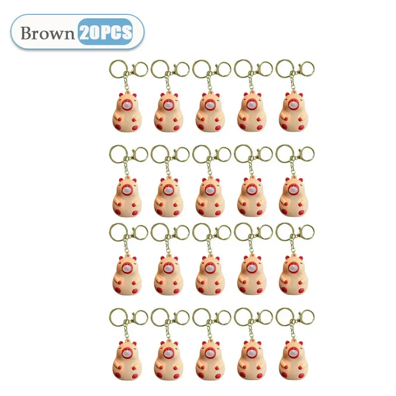 Brown pig-shaped capybara doll pinch keychain with red spots and pink nose for schoolbag doll pendant decoration