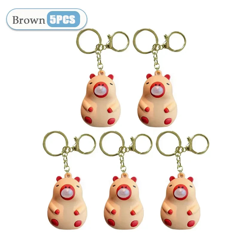 Brown hamster-shaped capybara doll pinch keychains with red accents and gold rings for schoolbag doll pendant spit bubble decompression