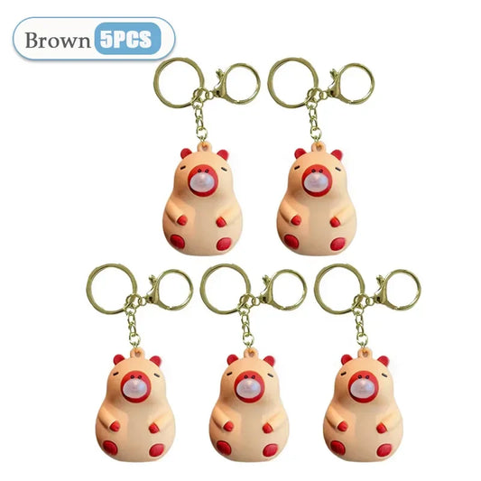 Brown hamster-shaped capybara doll pinch keychains with red accents and gold rings for schoolbag doll pendant spit bubble decompression
