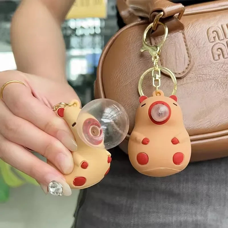 Beige and red capybara doll pinch keychain with clear spit bubble decompression feature for schoolbag doll pendant decoration