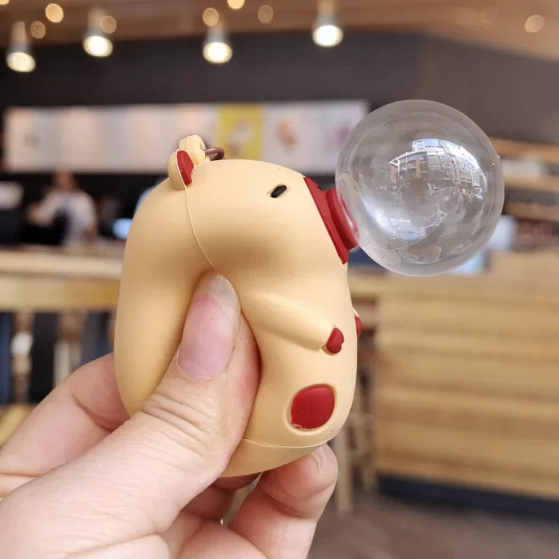 Beige and red silicone capybara doll pinch stress ball with clear spit bubble for decompression and schoolbag pendant