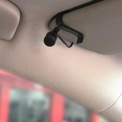 Black plastic car sun visor clip with rounded attachment for mini wired external microphone in auto dvd radio use