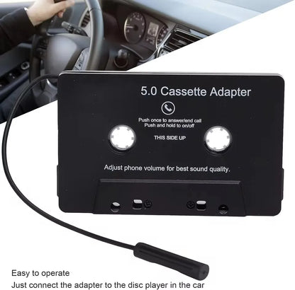 Black plastic cassette adapter with two buttons and coiled cable featuring microphone 6h music and standby smartphone cassette use