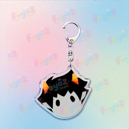 Clear acrylic cartoon homestuck keychain with black spiky hair and orange horns attached to silver metal clip charm karkat gamer keyrings