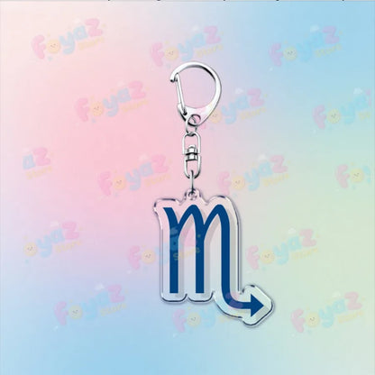 Silver-toned cartoon homestuck keychain with transparent acrylic pendant featuring blue scorpio symbol and arrow detail