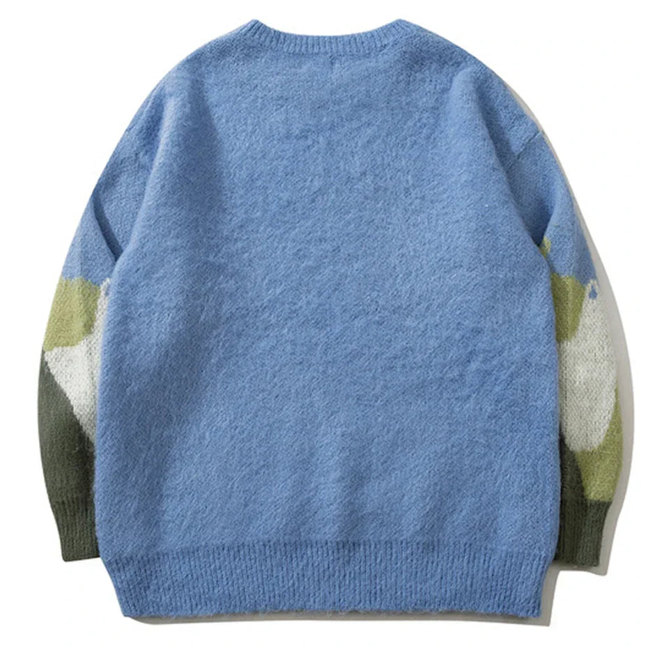 Blue fuzzy cat graphic knitted sweater with oversized hip hop fit and camouflage sleeves for casual streetwear