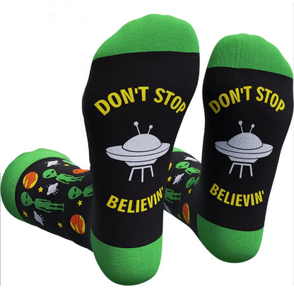 Black Cavertin men’s programming alien sasquatch socks with green toe and heel and white UFO graphic featuring sasquatch dad music text