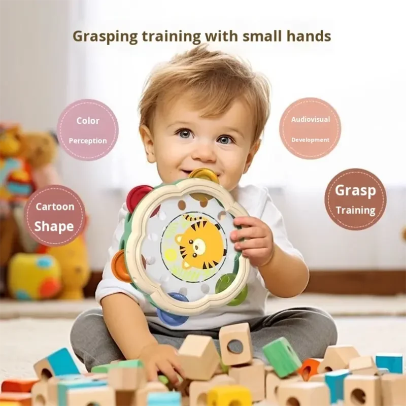 A child holds a colorful wooden bell drum percussion with a yellow tiger face for early education puzzle fun hand clapping