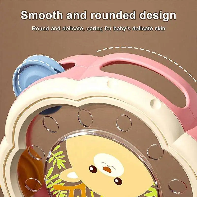 Pink and cream-colored baby rattle with cute yellow cartoon face for early education puzzle and fun hand clapping bell drum percussion