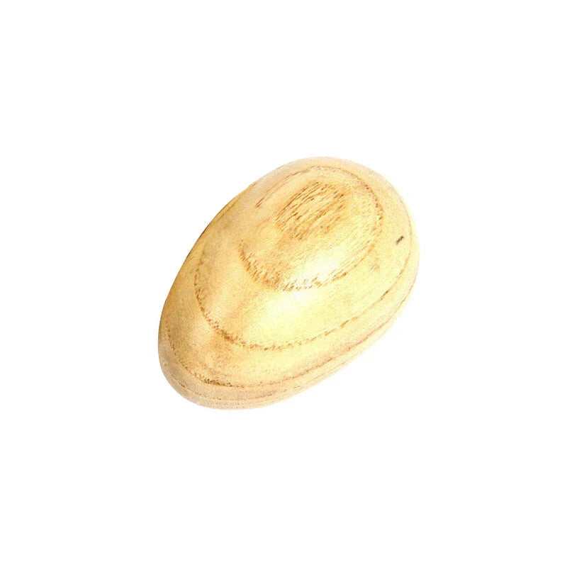 A smooth light-colored wooden egg-shaped kids rain rattle with natural grain for musical instruments toys and shaker rainmaker music