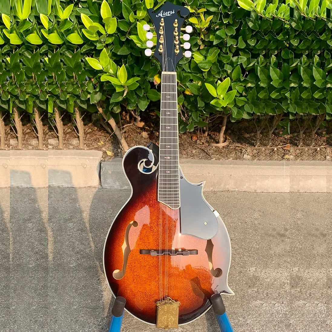 Aersi brand mandolin handmade vintage sunburst bluegrass acoustic archtop with glossy wooden body and silver pickguard
