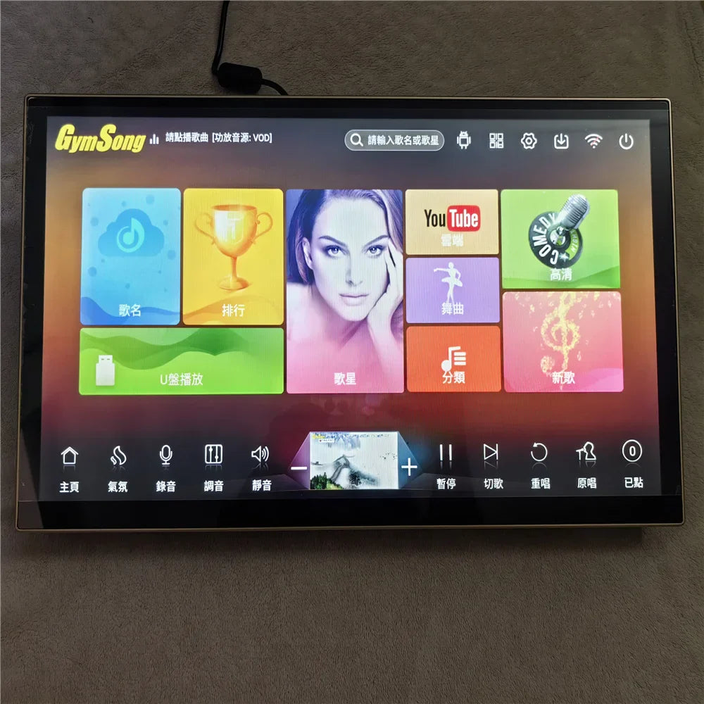 Black-framed portable touch screen displaying colorful music interface with app icons and chinese text for hdd jukebox home karaoke
