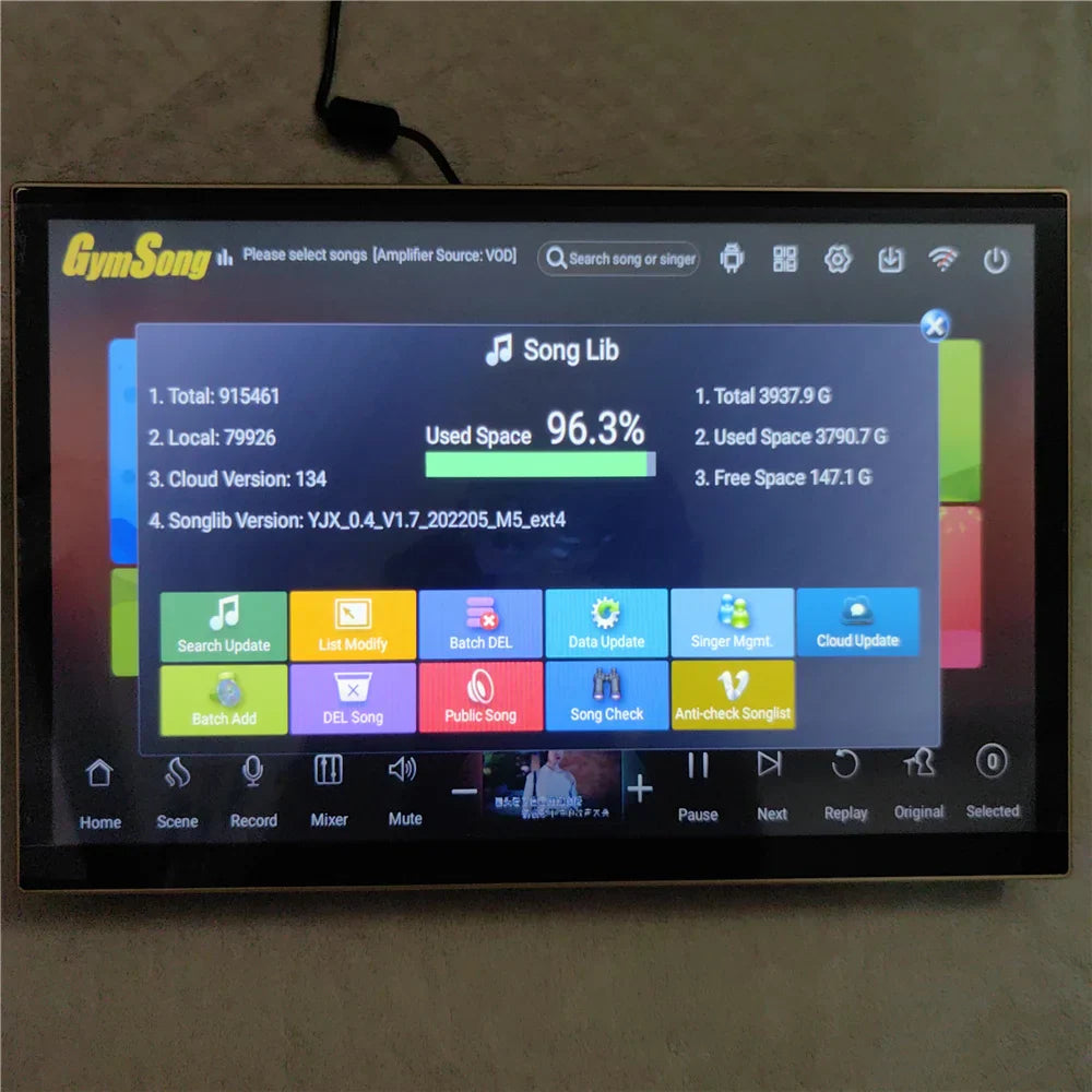 Black-framed portable touch screen hdd jukebox displaying gymsong music management for home karaoke use