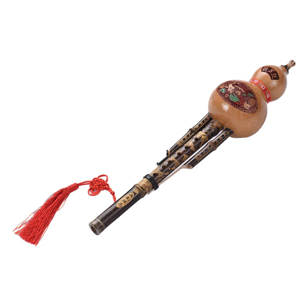 Hand-carved light brown bamboo hulusi gourd flute with black bamboo body and red tassel ethnic musical instrument key of c