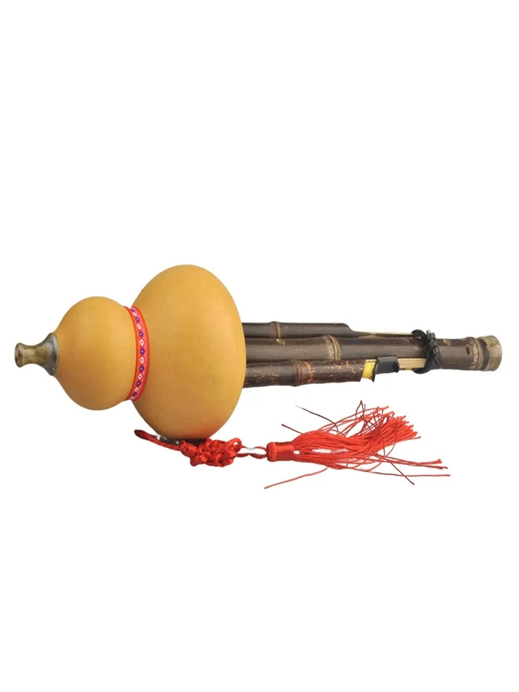 Traditional chinese handmade hulusi with natural beige gourd, dark bamboo tubing, and red tassels for beginner music lovers cucurbit c tune