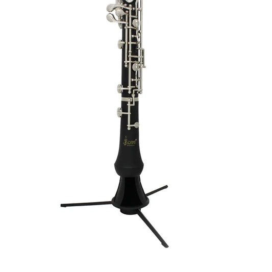 Black clarinet with silver keys and gold logo resting upright in a black tripod abs oboe clarinet stand bracket with felt pad