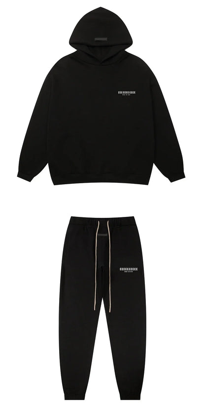 Black hoodie and joggers set with subtle white branding and matching drawstrings made from quality fleece sweatshirts for hiphop streetwear oversize look