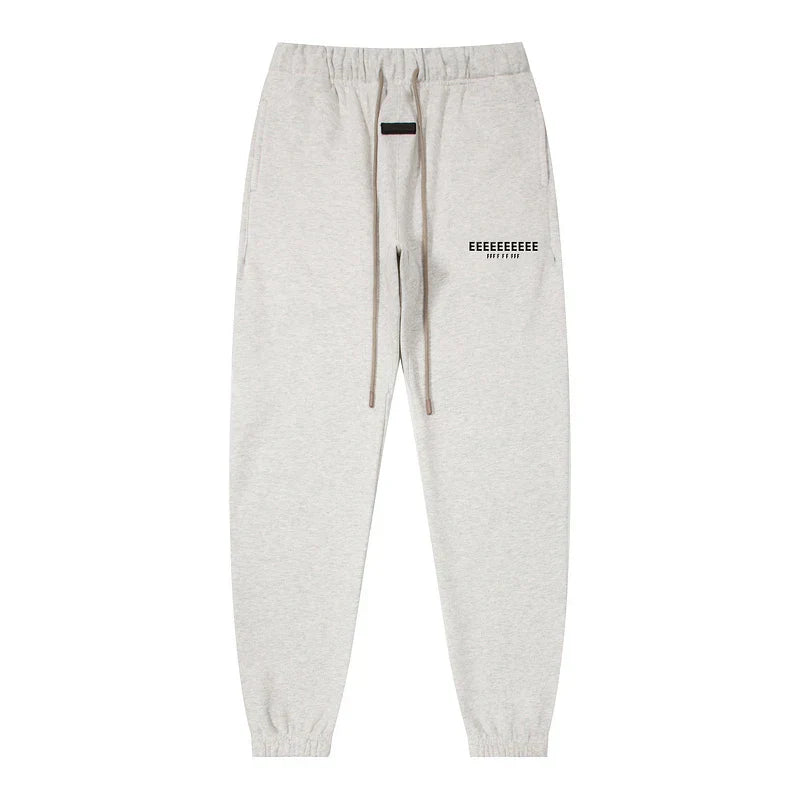 Light gray heathered sweatpants with drawstring waistband and black text for classic brand hoodies hiphop streetwear oversize set