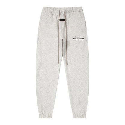 Light gray heathered sweatpants with drawstring waistband and black text for classic brand hoodies hiphop streetwear oversize set