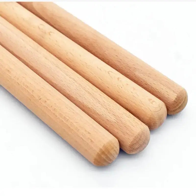 Light brown wooden classic claves rhythm sticks with smooth natural grain for percussion instrument kid use