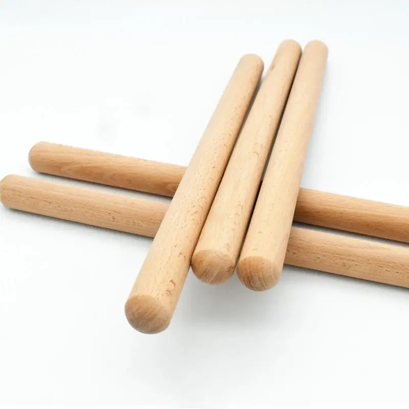 Light brown wooden classic claves rhythm sticks with smooth rounded ends natural wood grain claves percussion instrument kid