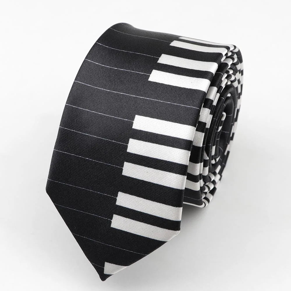 A sleek black and white piano key patterned polyester skinny tie with satin finish and colorful musical notes for party use