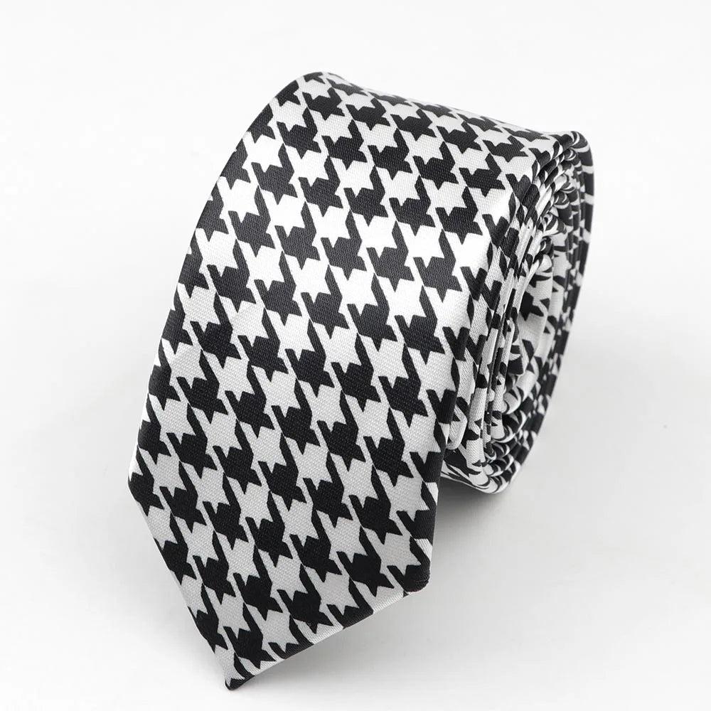A sleek black and white houndstooth patterned skinny tie made of smooth satin fabric perfect for width necktie party use